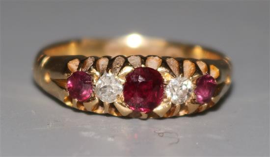A late Victorian 18ct gold ruby and diamond half hoop ring, size O.